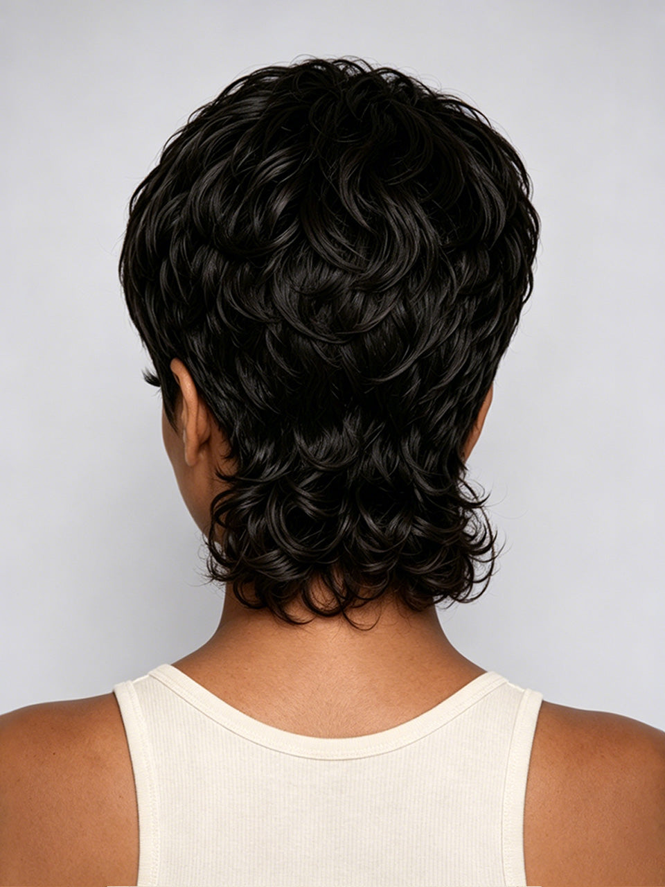 Short, layered wavy wig shown from the back on a model wearing a cream ribbed tank top, against a light gray background.