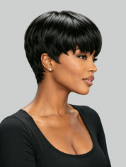 A woman shown in profile wearing a short, layered black wig against a plain light gray background.