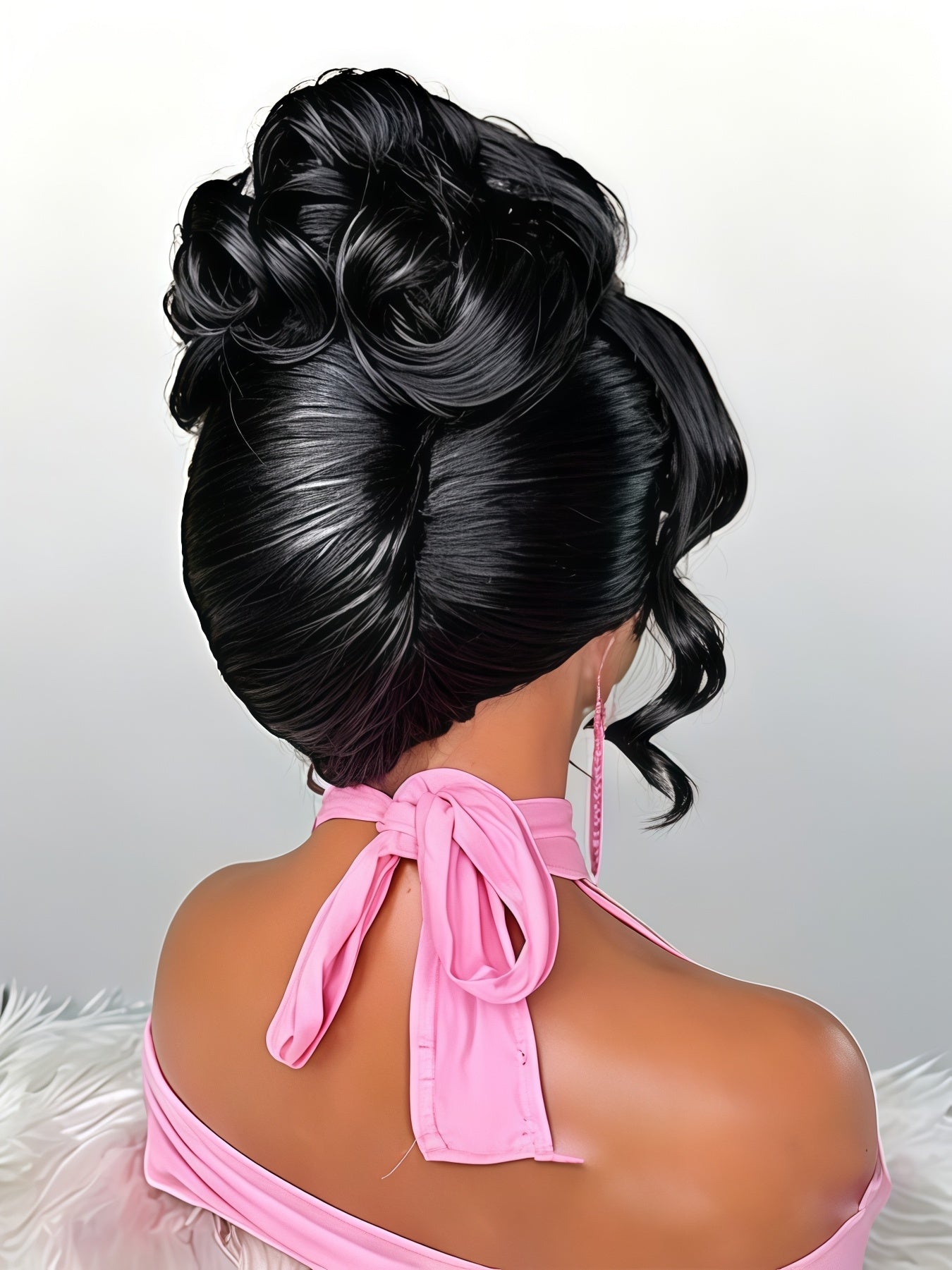 A black synthetic updo wig with a high, voluminous bun and side curls, shown on a mannequin from the back wearing a pink halter top against a light gray background.