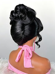 A black synthetic updo wig with a high, voluminous bun and side curls, shown on a mannequin from the back wearing a pink halter top against a light gray background.