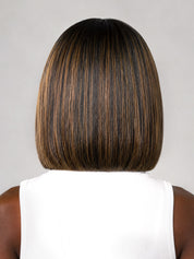 Rear view of a person with a straight, shoulder-length bob wig in dark brown with warm caramel and blonde highlights, wearing a white sleeveless top against a light gray background.