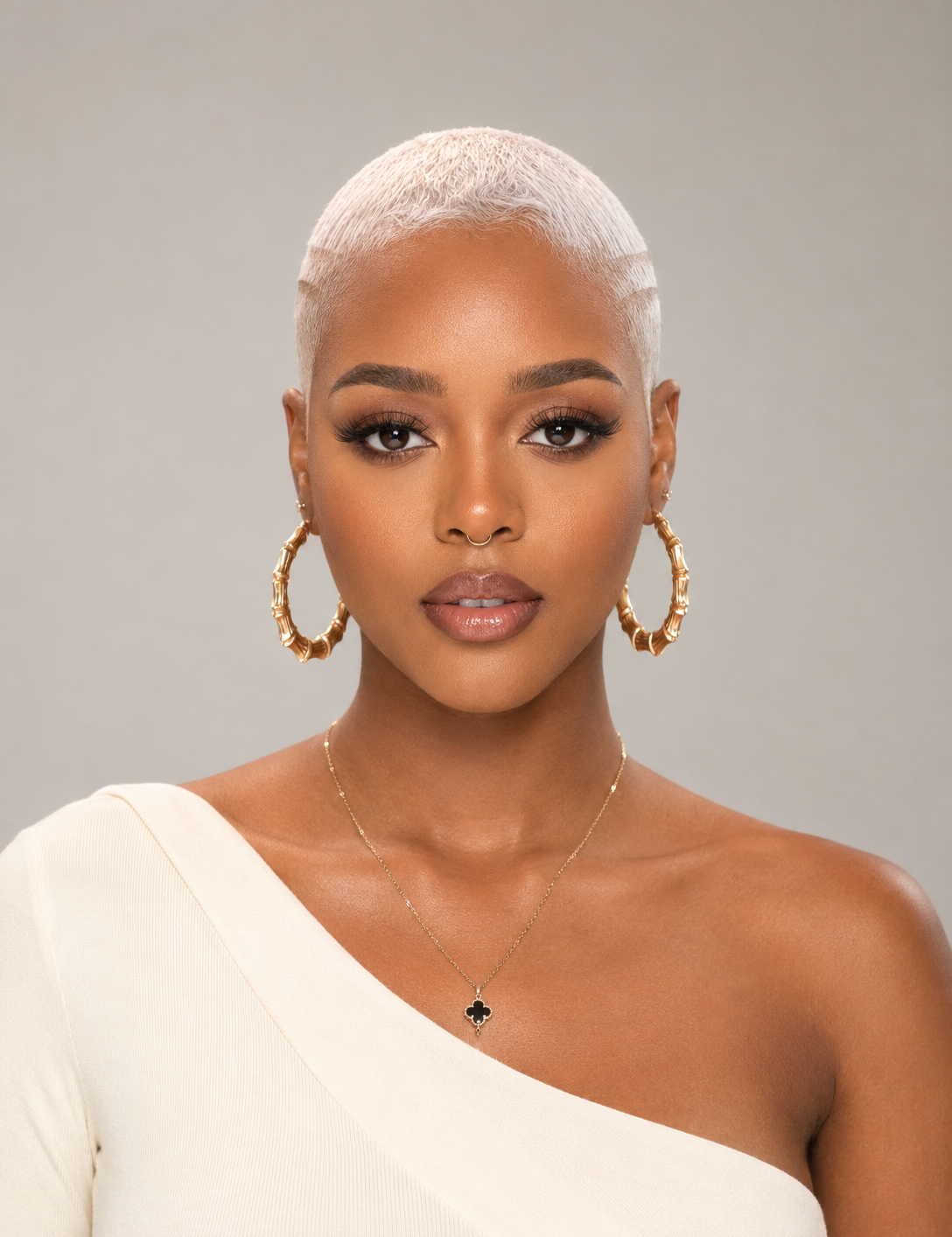 Front_view_of_blond_afro_lowcut_pixie_wig_with_hard_part_styling.png