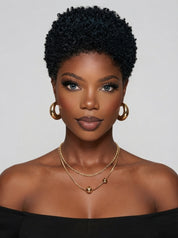 A close-up shot shows a woman wearing a black and green mixed low-cut curly wig. This glue-free, 100% human hair wig features a voluminous African texture and a neat hairline, making it perfect for everyday wear and easy to maintain.