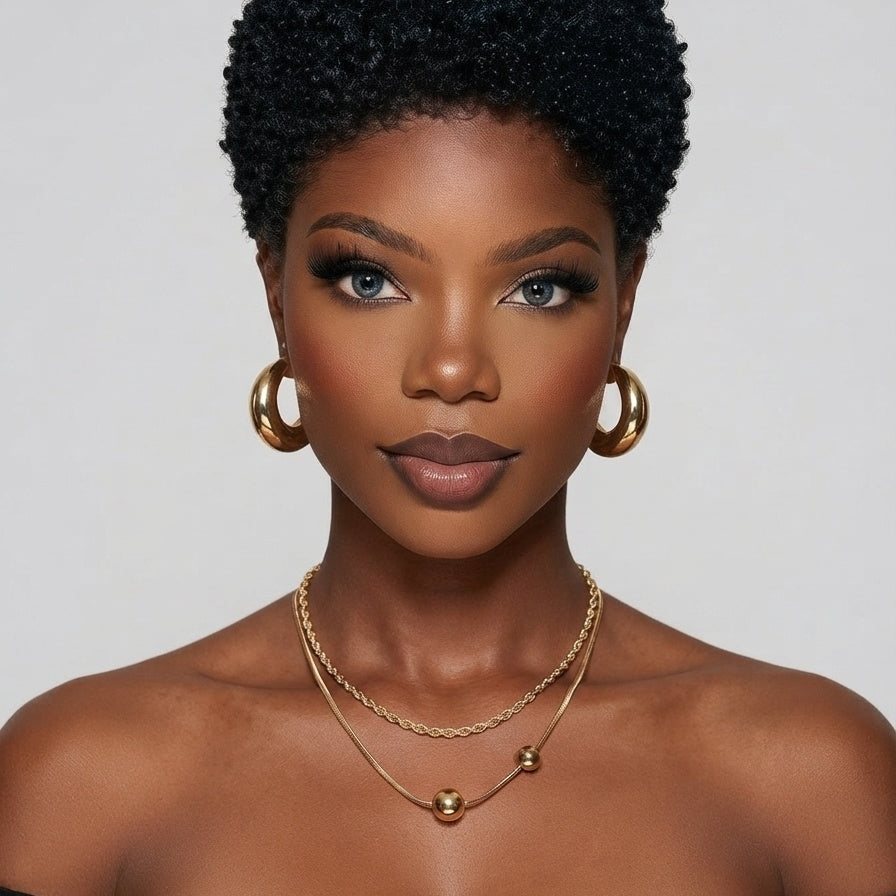 A close-up shot shows a woman wearing a black and green mixed low-cut curly wig. This glue-free, 100% human hair wig features a voluminous African texture and a neat hairline, making it perfect for everyday wear and easy to maintain.