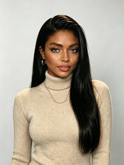 Black woman wearing a long straight 13x6 lace front wig in natural black. The glueless Brazilian human hair wig features a deep side part and realistic hairline