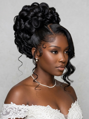 A woman with an elaborate updo hairstyle wearing a white lace off-the-shoulder top, set against a neutral gray background.