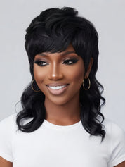 Frontal portrait of a smiling woman in a black wolf cut wig, featuring a fluffy crown and side-swept bangs. The hairstyle combines a short, choppy top with long, wavy layers at the bottom, creating a trendy and edgy look suitable for daily wear.