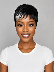 A woman with a short black wig featuring a bold diagonal white streak, wearing a plain white t-shirt against a neutral gray background.