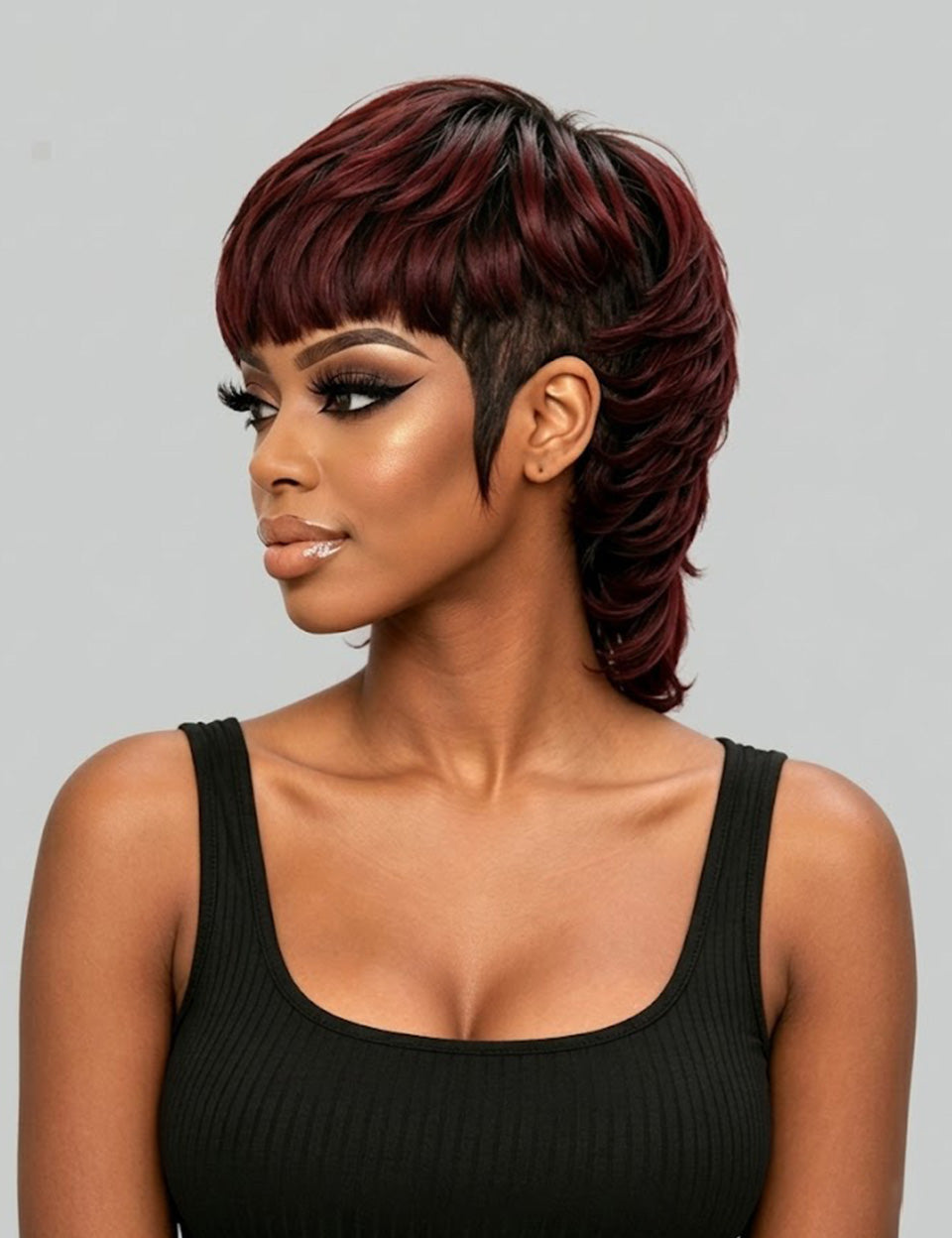 A woman modeling a short, layered wig with deep burgundy and dark brown tones, styled with a side-swept bang and undercut, against a solid gray background.