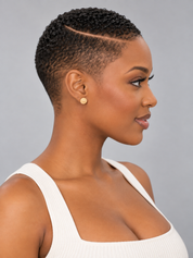 A woman in profile wearing a small round gold stud earring, shown against a plain gray studio background.