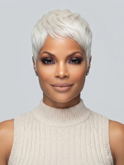 Frontal portrait of a model in a white blonde pixie cut wig with side-swept bangs. The wig has a voluminous crown and realistic hairline, framing the face perfectly for a chic and professional look.