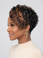 Side profile close-up of a short curly pixie wig featuring a striking black to caramel ombre color. The tight spiral curls create a voluminous texture on top, while the tapered nape offers a clean and neat finish around the ear.