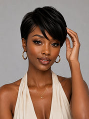 Model showcasing a sleek black human hair pixie wig. This short layered style features a realistic scalp look and adjustable straps for a secure fit.