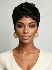 Front view of a woman wearing a short black curly pixie wig with defined finger coils. The tight spiral texture and natural hairline create a bold, retro-inspired look that frames the face perfectly.