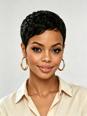 Frontal portrait of a woman wearing a short black curly pixie wig with defined wave pattern. The symmetrical layers and natural parting create a balanced look, perfect for those seeking a bold yet polished short hairstyle.