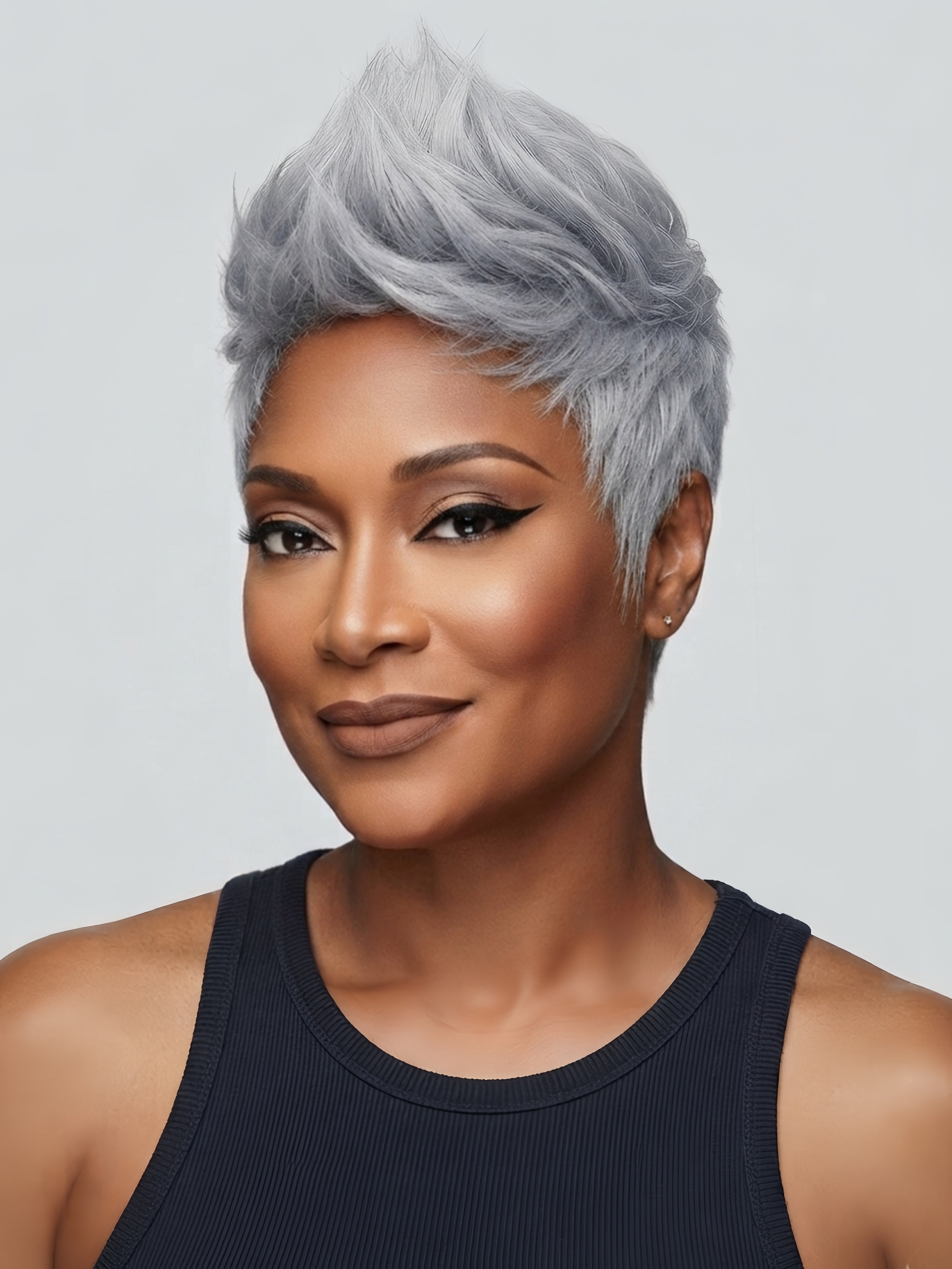 Smiling model wearing a chic salt and pepper pixie cut wig with a natural parting. The straight human hair wig offers a mature yet trendy look, suitable for daily wear or special occasions.
