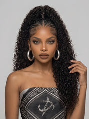 Frontal close-up of a woman wearing a high-volume curly lace front wig with braided crown and soft, bouncy waves. Emphasizes the wig’s realistic hairline and luxurious texture, complemented by large silver hoop earrings and a chic strapless top.