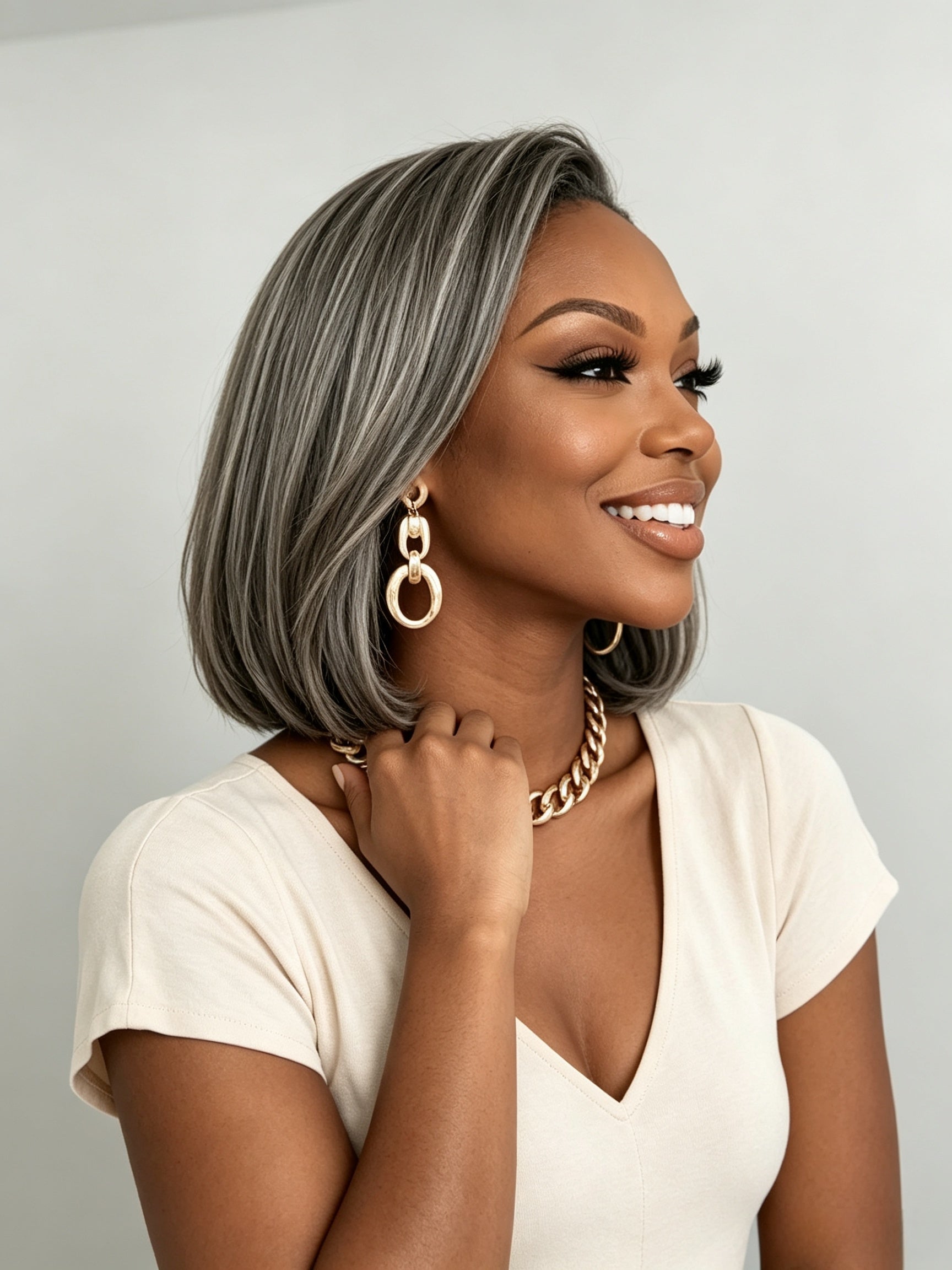 Side profile showcasing the sleek straight cut and layered volume of the salt and pepper bob wig. This angle highlights the realistic density of the gray strands and how the style sits neatly around the jawline for a polished finish.