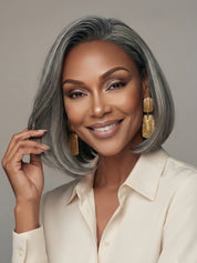 Close-up angled shot emphasizing the glossy texture and natural parting of the salt and pepper bob wig. The detailed view demonstrates the high-quality definition of each strand, offering a chic and low-maintenance hairstyle option for mature women.