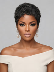 Frontal portrait of a model in a salt and pepper short curly wig, showcasing symmetrical curls framing the face. The defined hairline and voluminous top create a bold, confident look, enhanced by dramatic eye makeup and statement pearl earrings.