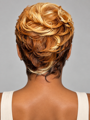 Back view of a person wearing a short textured hairstyle with layered golden blonde, caramel brown, and dark brown tones against a plain gray background.