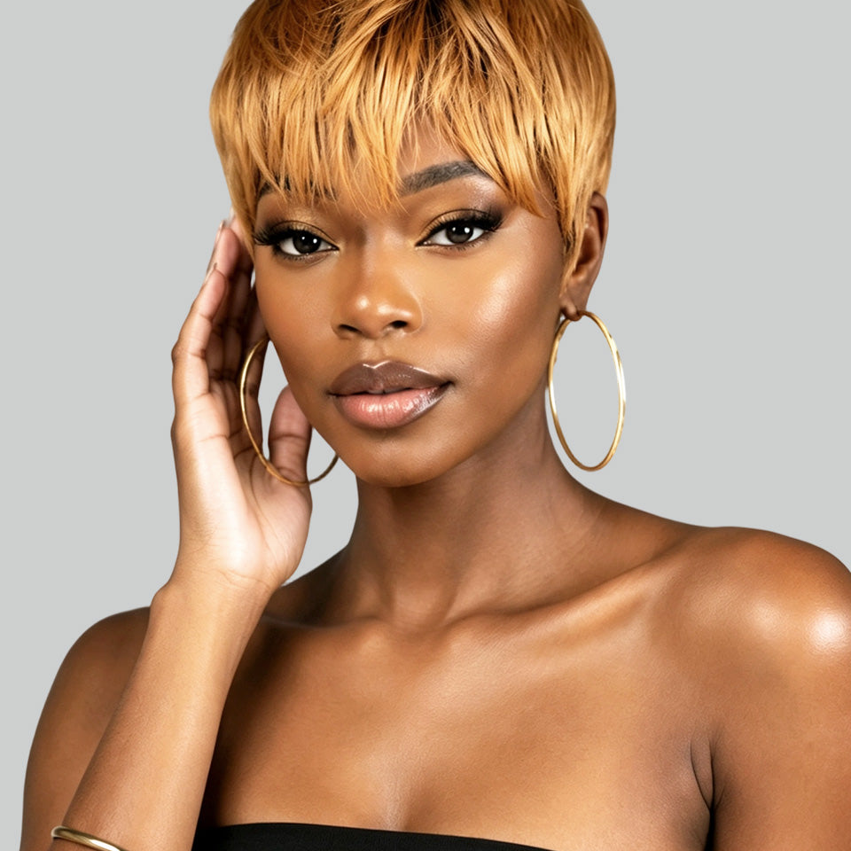 Rear view of a person with a short, layered, textured black wig or hairpiece against a solid light gray background.