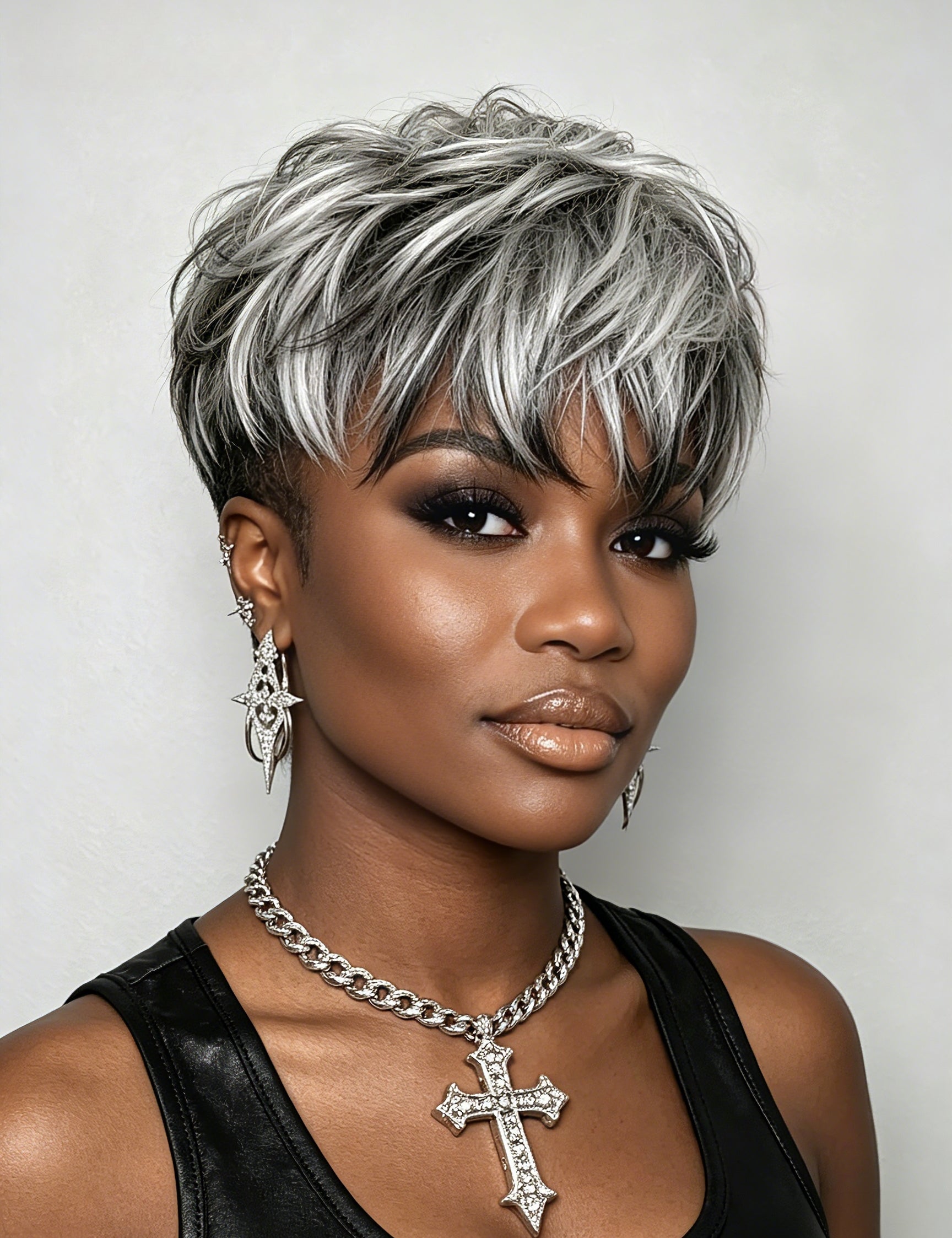 Front close-up of a woman wearing a textured grey and black human hair topper. The natural-looking parting and multi-tonal highlights create a vibrant, full appearance ideal for covering thinning crowns.