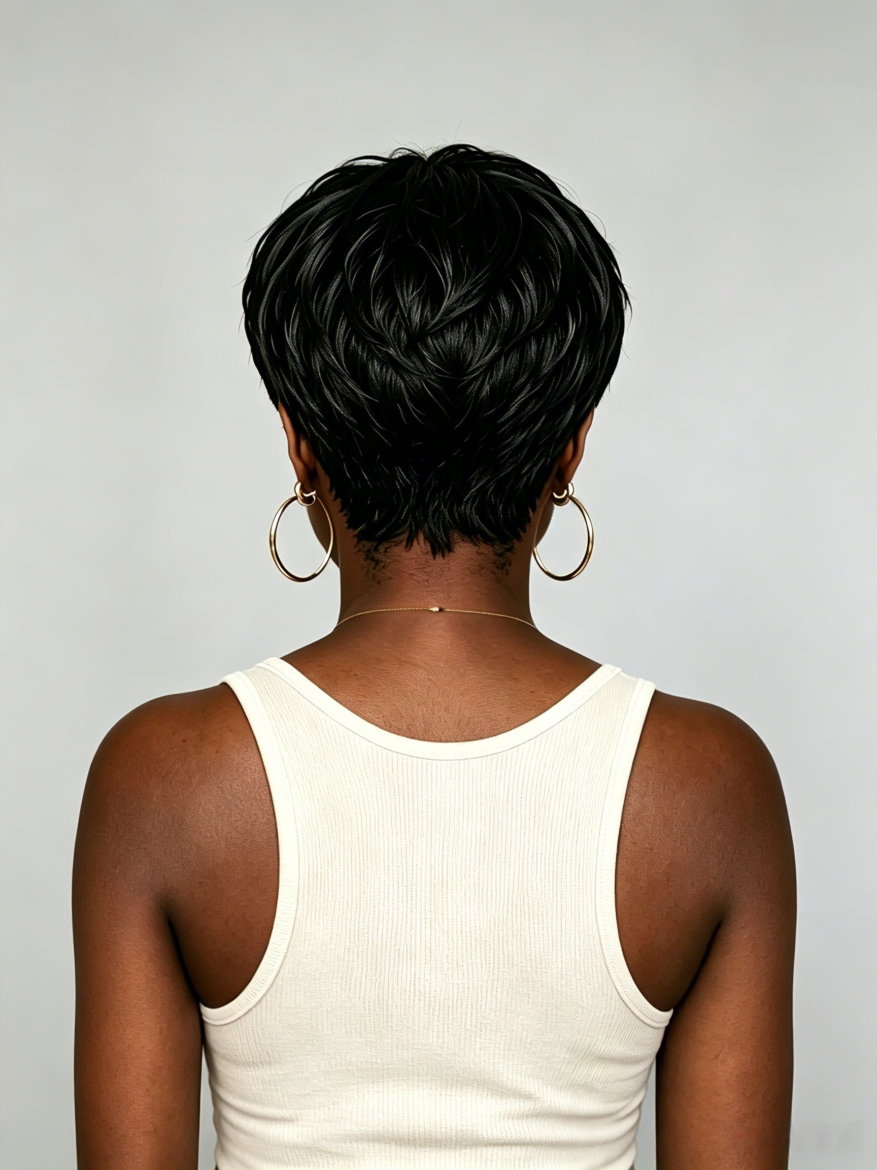 Back view showcasing the clean taper and natural fall of the black short wig. The smooth texture and precise cut at the nape highlight the wig’s realistic construction and easy maintenance for glueless wear.