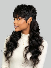 A woman shown in profile wearing a long, dark wavy wig with a side-swept bang and a half-up style with loose curls. The product being shown is the wig, and because wigs are an exception where hair color is the product color, the color identity is black.