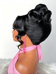 A black wig styled in a high volume updo with side-swept bangs and curled lower layers, shown on a mannequin wearing a pink halter top against a light gray background.