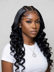 A woman with long, glossy, black, body-wave hair styled with cornrow braids at the top, wearing a white t-shirt and a silver necklace against a light gray background.