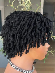 Black twisted loc hair extensions styled on a mannequin head, shown from a side profile view with a silver chain necklace.