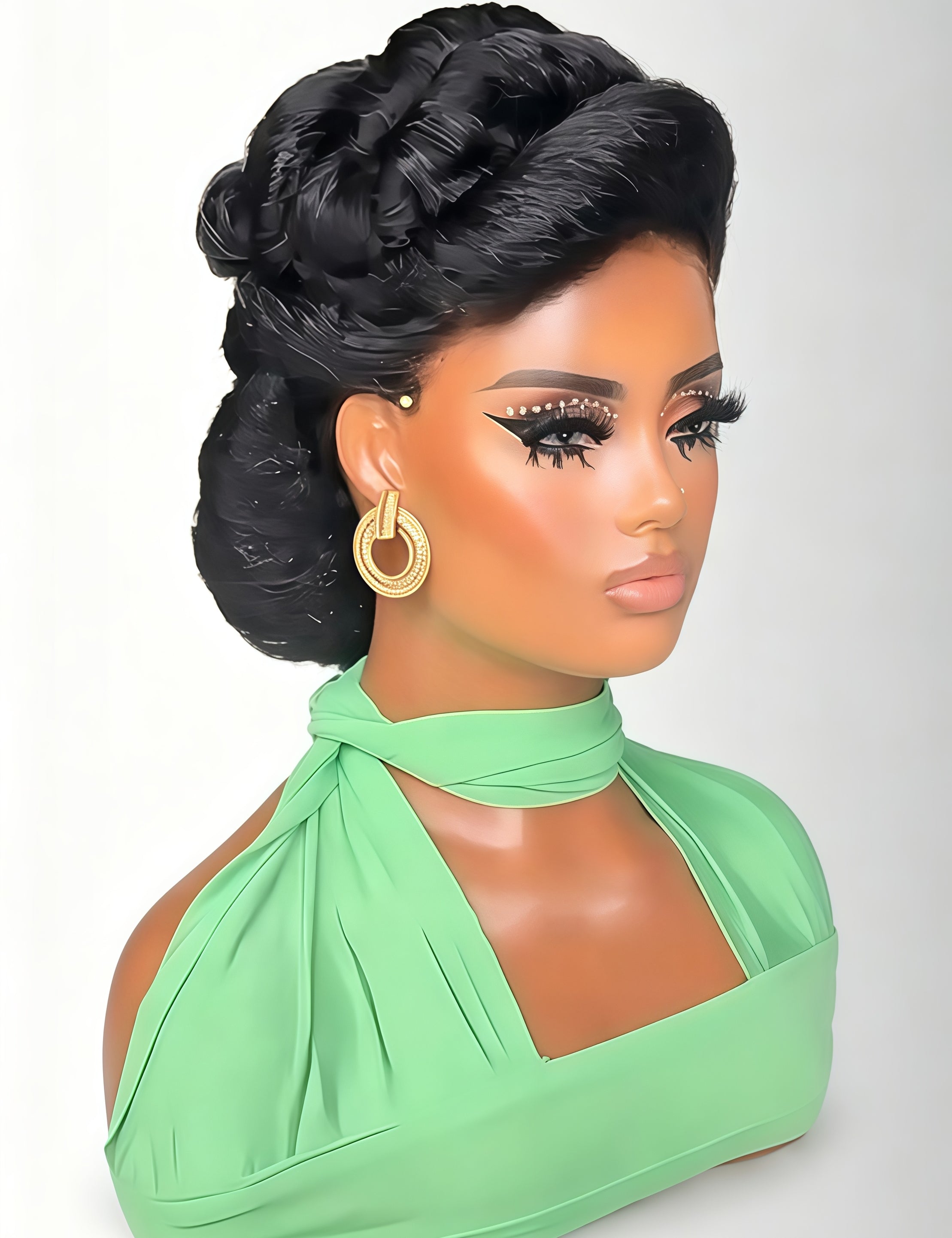 A black synthetic braided wig styled in an elegant updo with twisted braids and ringlets, displayed on a mannequin bust wearing a mint green halter top and gold hoop earrings against a light gray background.