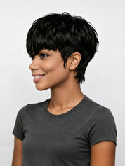 A woman with a short, layered black wig or hairpiece shown in profile against a light gray studio background. Since wigs are an exception where hair color is the product color, the product color is classified as Black.