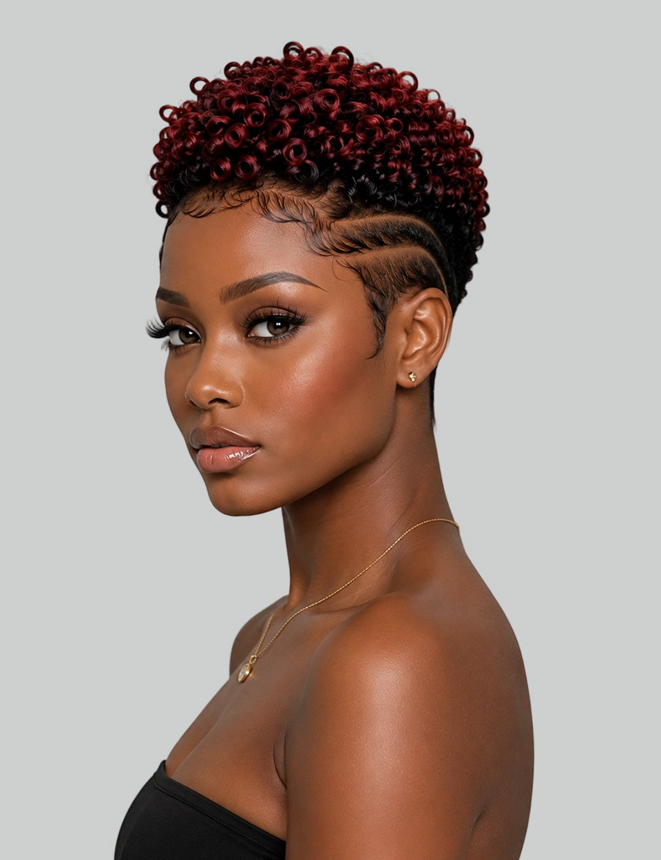 Side_view_of_claret_red_afro_curly_pixie_wig_with_fade_and_hard_part.jpg