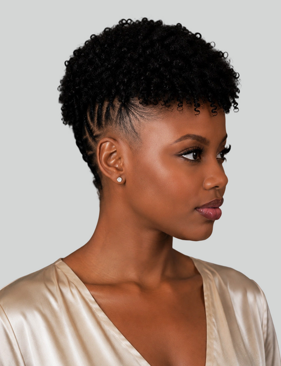 Side_view_of_kinky_curly_pixie_wig_with_cornrow_details_on_natural_hair.jpg